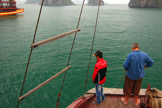 Quan and John doing a little fishing off the bow.