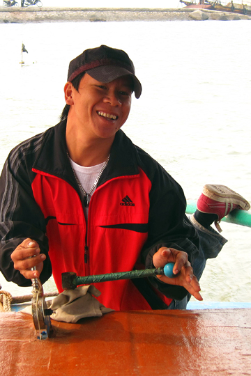 Our happy ferryman on Cat Ba Island.