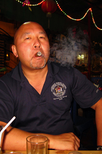 After-dinner cigar at the Quan Bia Minh Restaurant, Hanoi.