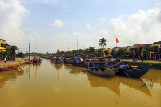 Fishing boats tied up in a canal off the Thu Bon River. Old Town, Hoi An.