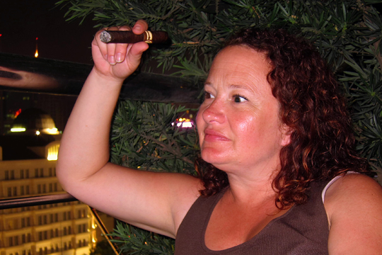 Eron having a cigar on the rooftop patio of the Saigon Saigon Bar. Caravelle Hotel, Saigon.