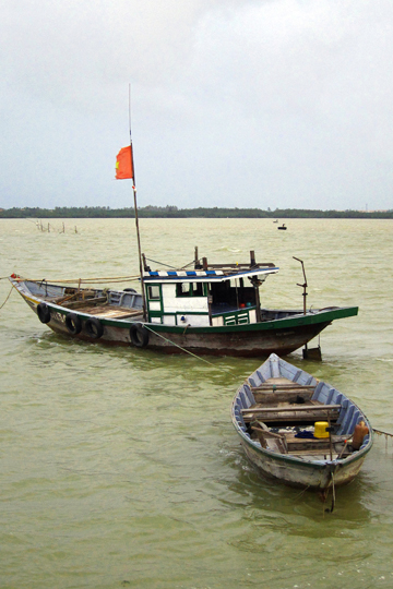 Anchored vessels, fishing village near Hoi An.