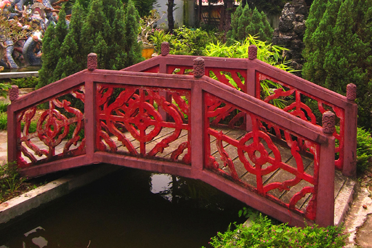 Red garden bridge. Old Town, Hoi An.
