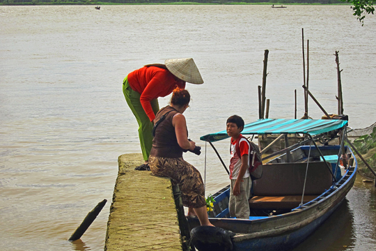 Getting back aboard, near Can Tho.