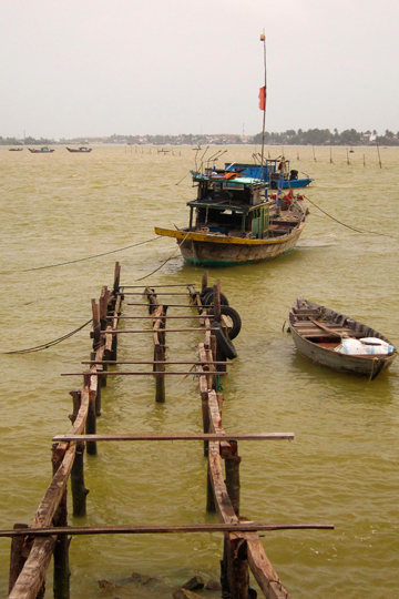 Old dock and boats, fishing village near Hoi An.