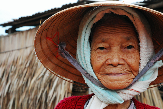 Old woman, fishing village near Hoi An.