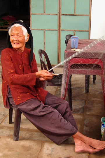 Net mending, fishing village near Hoi An.