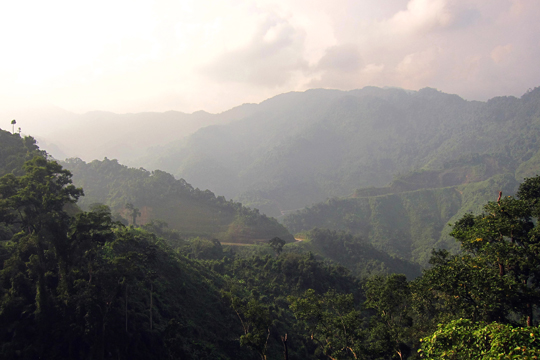 Road clings to the edge of the mountains, Central Highlands.