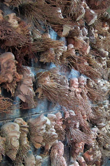 Masks carved from roots. Central market, Hoi An.