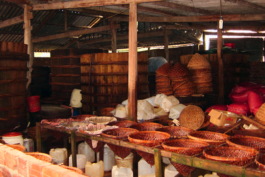 Fish Sauce fermenting casks, fishing village near Hoi An.