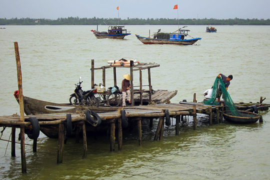 Busy at the dock, fishing village near Hoi An.