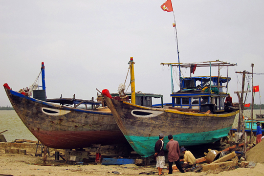 Boats in dry-dock, fishing village near Hoi An.