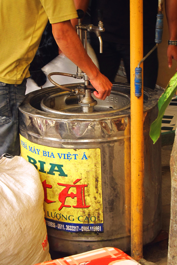 Tapping a fresh keg of local biere, Hoi An.