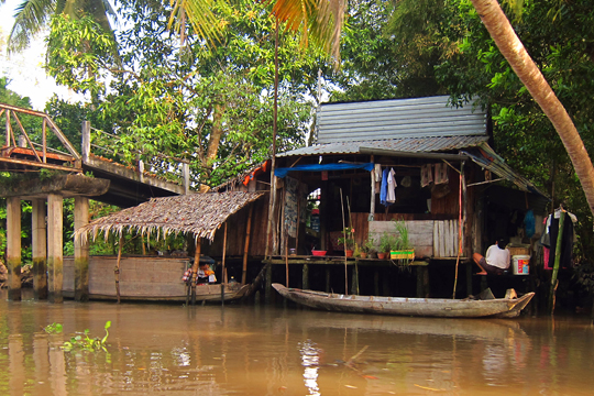 A home beside the foot-bridge, near Can Tho.
