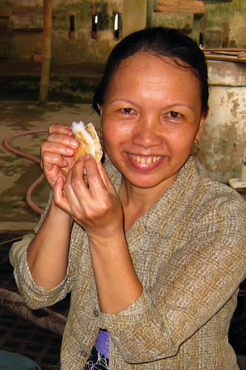 Serving a rice paper snack, Quang Nam Prov.