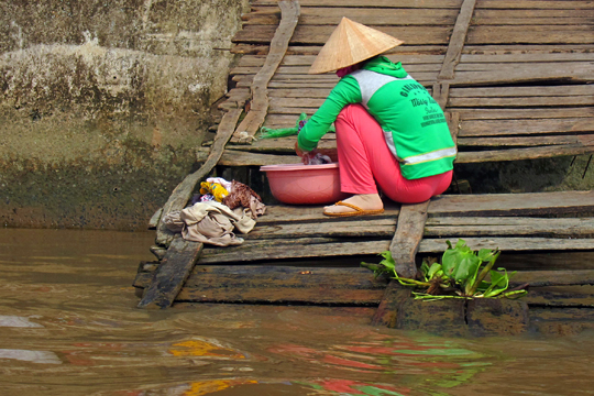 Doing laundry on the Mekong, near Can Tho.