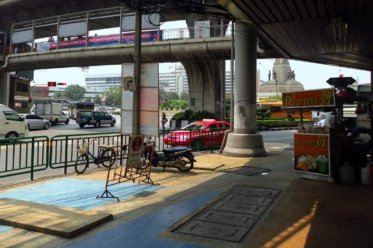 Near Victory Monument under the BTS Skytrain Station.