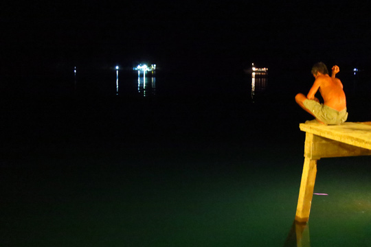 Quiet-time for a local on a pier next to the restaurant.