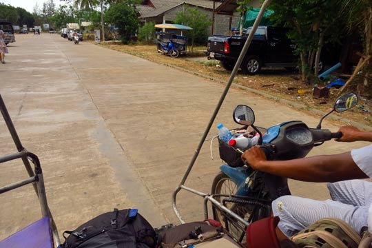 Riding through Ban Saladan in a sidecar tuk-tuk.