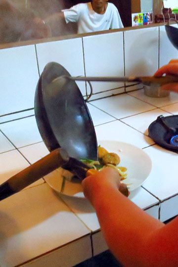 Eron plating her Chicken, Chili, and Cashew Nuts.