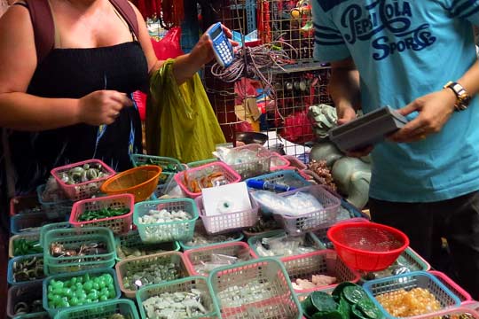 Striking a deal for some cut stones.