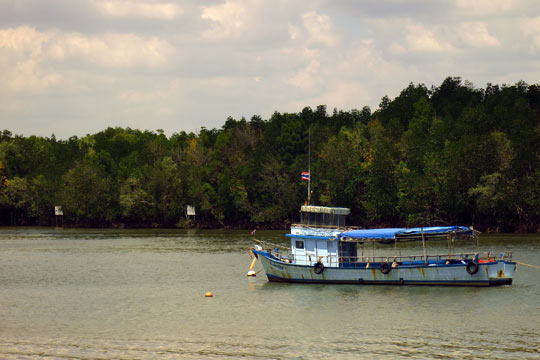 Boat anchored in Krabi River.