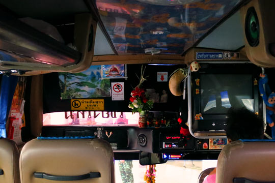 Front of the bus; driver sits to the right at the extreme bottom.