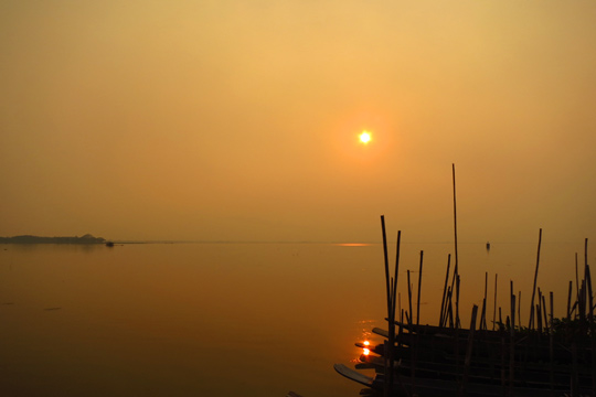 Hazy sun over Pha Yao Lake.