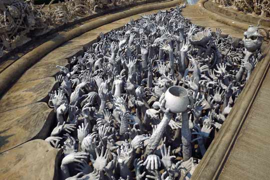 The main path into the temple is flanked by legions of the damned.