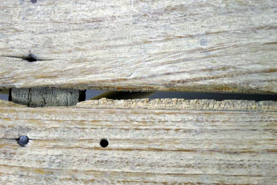 Nice view of the exhaust pipe and road through the floor-boards.