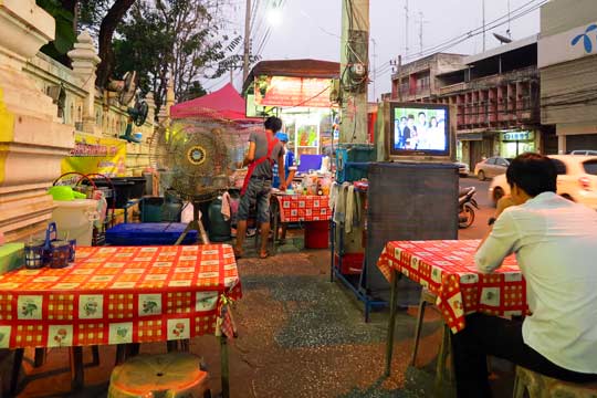 Street-restaurant with TV and fans.