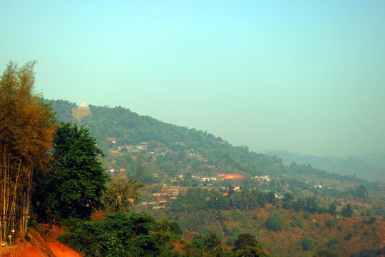 Wat Santikhiri dominates the town below.
