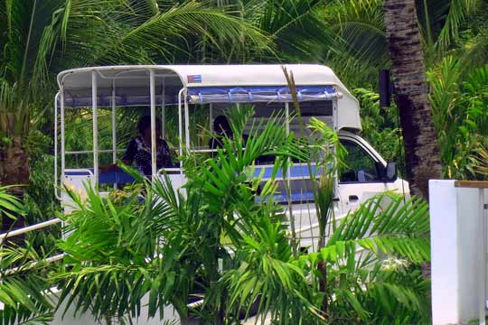 Suzuki shuttle-truck taking guests to their rooms.