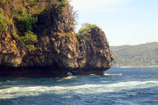 We round the point from Koh Phi Phi's harbour area.