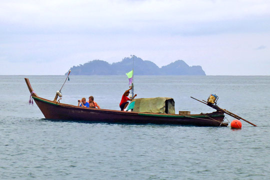 Longtail boat with tourists.