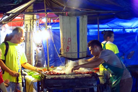 BBQ meat stand at market.