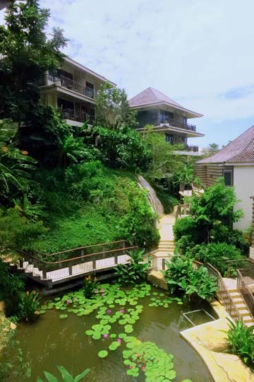 The lobby overlooks a waterfall and pond.