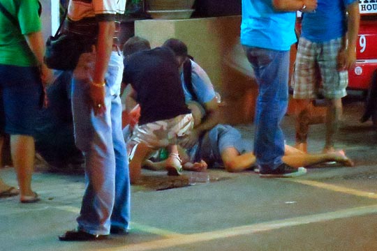 Tourist collapses in the heat and humidity.